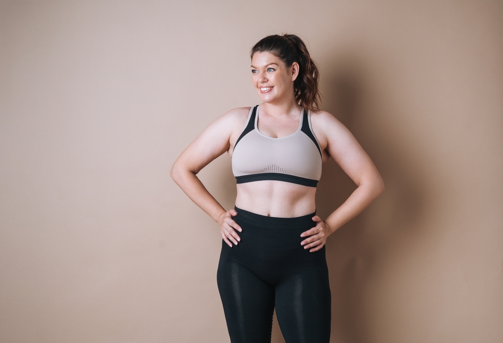 self,loving,young,woman,plus,size,in,sport,wear,on